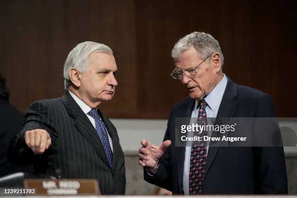 Committee chairman Sen. Jack Reed talks with ranking member Sen. James Inhofe before the start of a Senate Armed Services hearing on Capitol Hill...