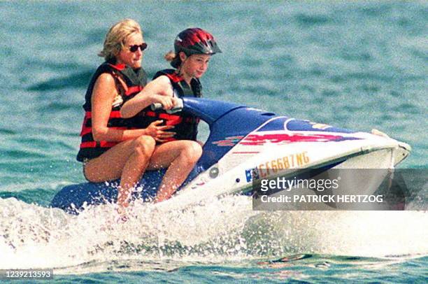 Britain's Lady Diana is taken by an unidentified young girl for a jet-ski ride 14 July off the property of her friend Mohammad Al-Fayed in Saint...