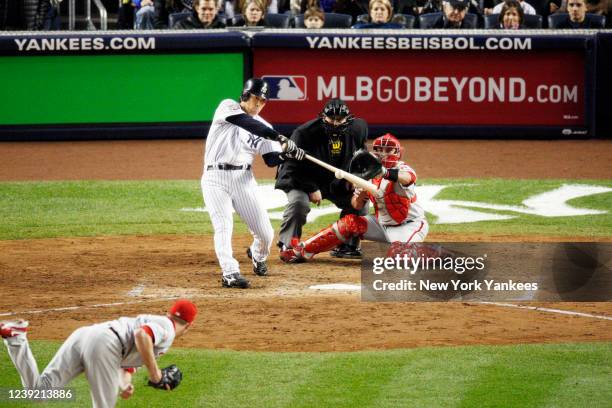 Hideki Matsui of the New York Yankees hits a two-run double in the bottom of the fifth inning against the Philadelphia Phillies in Game 6 of the 2009...