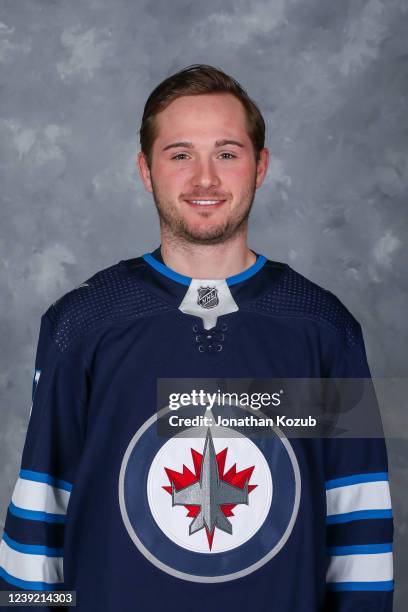 Adam Brooks of the Winnipeg Jets poses for his official headshot for the 2021-2022 season on March 15, 2022 at Canada Life Centre in Winnipeg,...