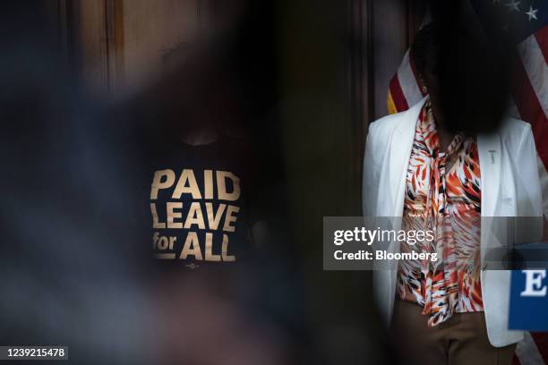 Bethany Fauteux, a member of Paid Leave for All's Voices of Workers Advisory Group, wears a Paid Leave for All shirt during an Equal Pay Day event at...