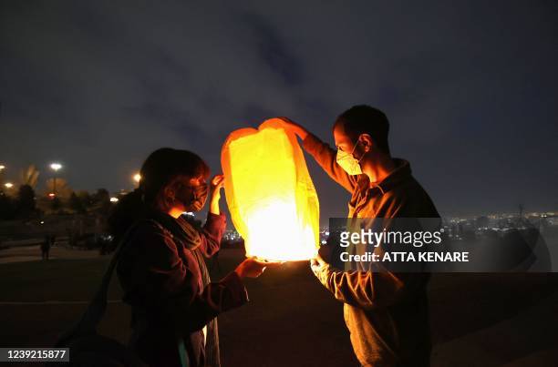 Iranians release a lantern during the Wednesday Fire feast, or Chaharshanbeh Soori, held annually on the last Wednesday eve before the Spring holiday...