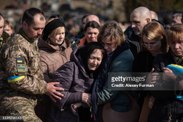 Mother of Oleh Yaschyshyn cries during the funeral service for Oleh Yaschyshyn, Sergiy Melnyk, Rostyslav Romanchuk and Kyrylo Vyshyvany in...