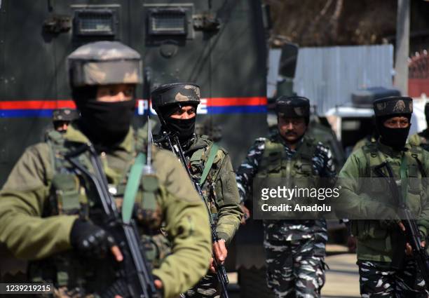 Indian forces arrive during the encounter between militants and security forces in Chersoo area of Awantipora in south Kashmir on March 15,2022. One...