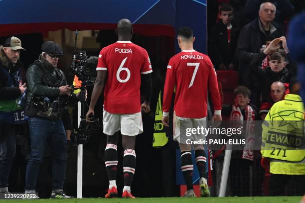 Manchester United's French midfielder Paul Pogba and Manchester United's Portuguese striker Cristiano Ronaldo leave straight after the final whistle...