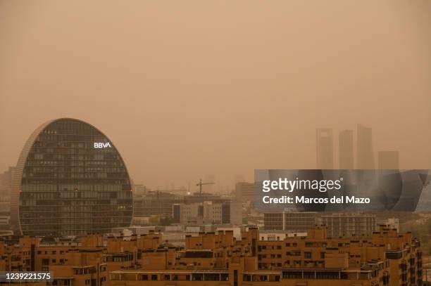 Bank headquarters and Four Towers Business Area are seen with mist generated by a high amount of dust particles in suspension coming from the Sahara,...