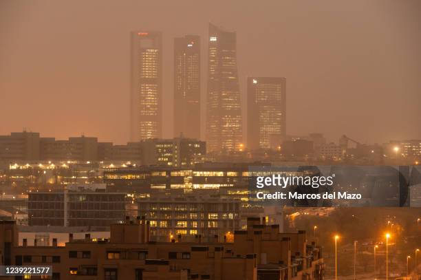 The skyscrapers of the Four Towers Business Area is seen with mist generated by a high amount of dust particles in suspension coming from the Sahara,...