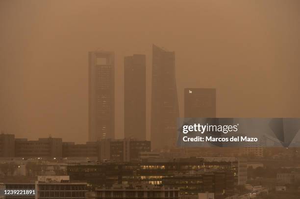 The skyscrapers of the Four Towers Business Area is seen with mist generated by a high amount of dust particles in suspension coming from the Sahara,...