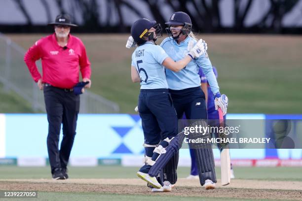 Englands Heather Knight and Sophie Ecclestone celebrate winning the match during the 2022 Women's Cricket World cup match between England and India...