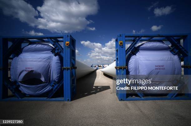 Sections of a wind turbine towers are pictured during their assembly for the Taranto offshore wind turbines farm on March 10, 2022 in Taranto,...