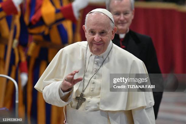 Pope Francis arrives to hold an audience on March 16, 2022 for the 50th anniversary of Milan's school "La Zolla", at St. Peter's basilica in The...