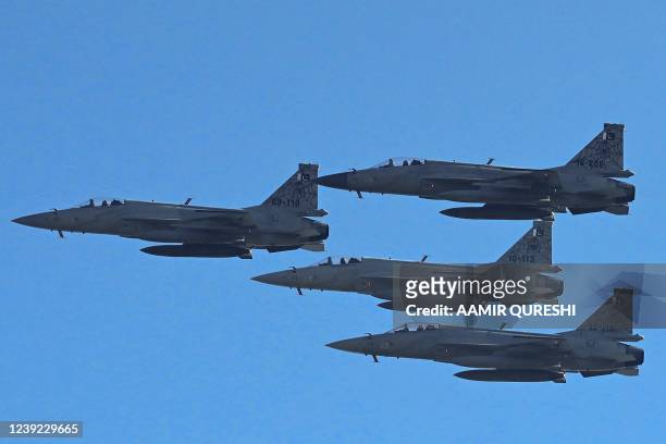 Pakistan Air Force JF-17 fighter jets perform a flypast during a rehearsal ahead of Pakistan's Day parade on March 23, in Islamabad on March 16, 2022.
