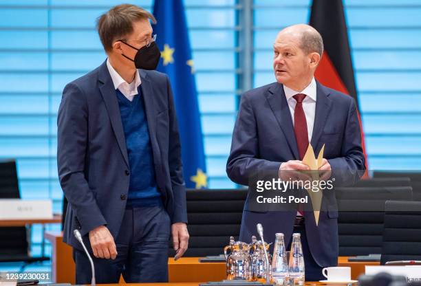 Karl Lauterbach , Federal Minister of Health and German Chancellor Olaf Scholz attend a weekly government cabinet meeting in the Federal Chancellery...
