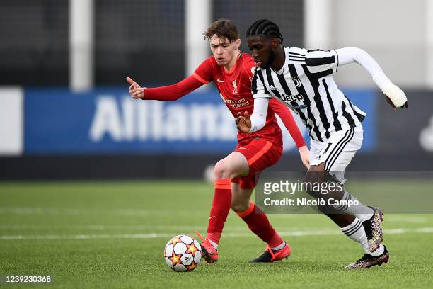 Samuel Iling-Junior of Juventus FC U19 competes for the ball with Conor Bradley of Liverpool FC U19 during the UEFA Youth League quarterfinal...