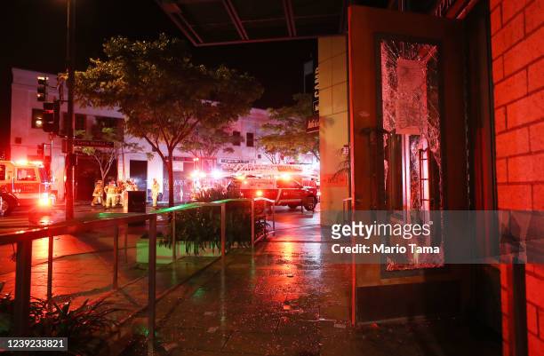 Firefighters work to extinguish a fire at a section of shops looted amid demonstrations in the aftermath of George Floyd’s death on May 31, 2020 in...