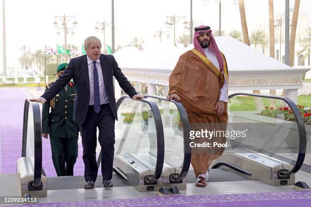 Prime Minister Boris Johnson is welcomed by Mohammed bin Salman Crown Prince of Saudi Arabia ahead of a meeting at the Royal Court on March 16, 2022...