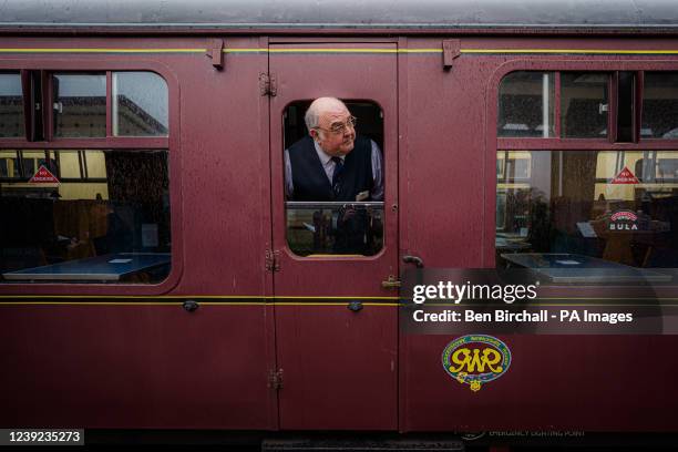 Train staff check the platform at Toddington ststion aboard a special heritage steam express train service taking race goers to the Cheltenham...