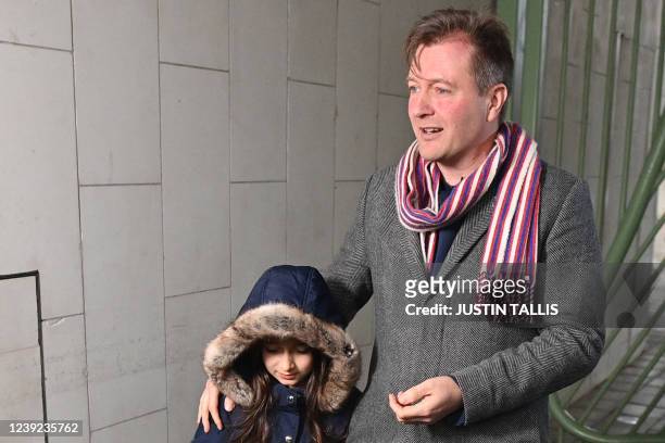 Richard Ratcliffe , husband of Nazanin Zaghari-Ratcliffe, a British-Iranian held in Iran since 2016, flanked by their daughter Gabriella , holds a...