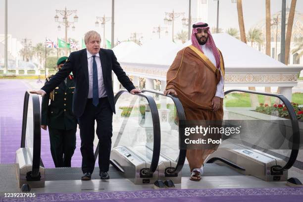 Prime Minister Boris Johnson is welcomed by Mohammed bin Salman, Crown Prince of Saudi Arabia, ahead of a meeting at the Royal Court on March 16,...