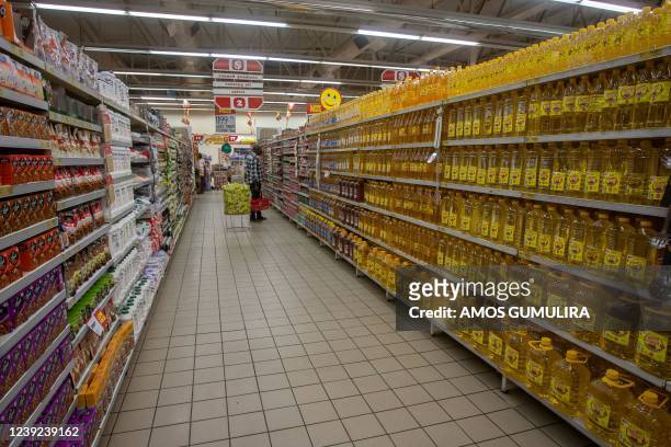 Cooking oil and other edibles are seen for sale in Shoprite in Lilongwe, Malawi, March 16, 2022. - From airlines in Nigeria to shoppers in Malawi,...
