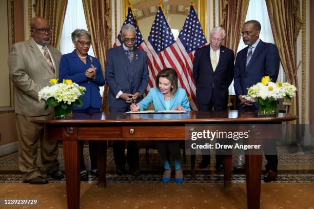 Speaker of the House Nancy Pelosi signs the Emmett Till Anti-lynching Act during a bill enrollment ceremony at the U.S. Capitol March 16, 2022 in...