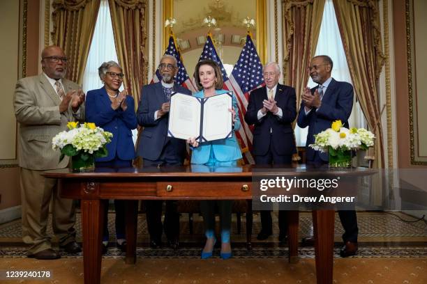 Speaker of the House Nancy Pelosi signs the Emmett Till Anti-lynching Act during a bill enrollment ceremony at the U.S. Capitol March 16, 2022 in...