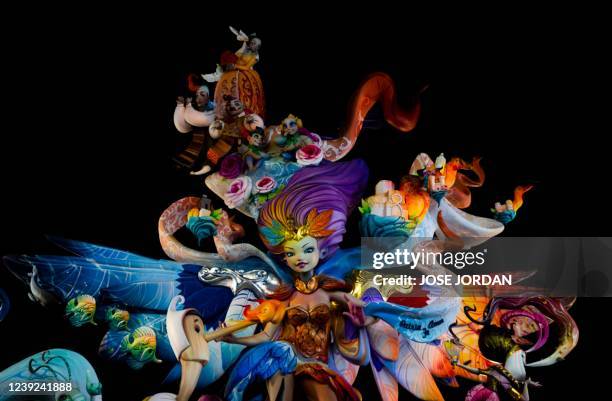 Falla' is pictured during the Fallas festival in Valencia, on March 16, 2022. - The fallas, gigantic cardboard structures that portray current events...