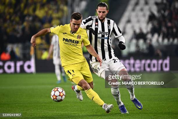 Villarreal's Argentine midfielder Giovani Lo Celso works around Juventus' French midfielder Adrien Rabiot during the UEFA Champions League round of...