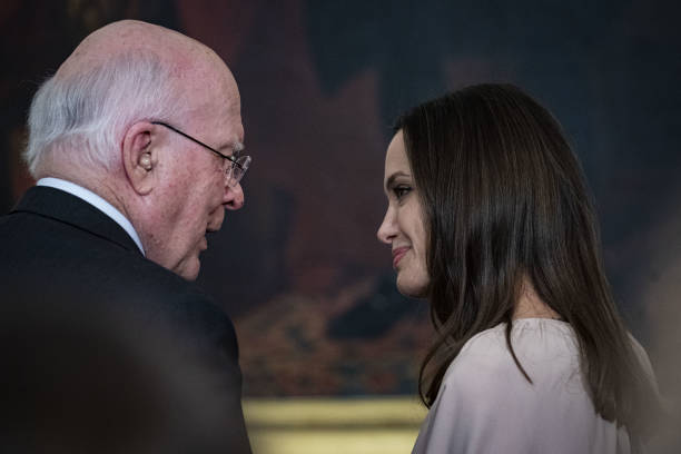 Senator Pat Leahy, a Democrat from Vermont, speaks with actress Angelina Jolie during an event celebrating the reauthorization of the Violence...