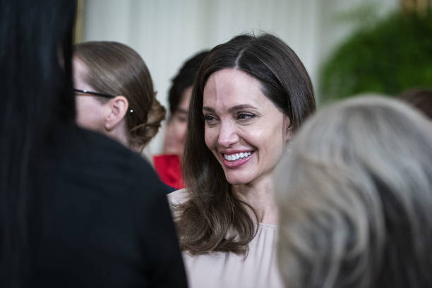 Actress Angelina Jolie departs following an event celebrating the reauthorization of the Violence Against Women Act in the East Room of the White...