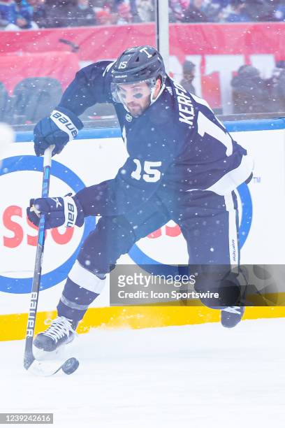 Toronto Maple Leafs Center Alexander Kerfoot skates with the puck during the NHL Heritage Classic game between the Toronto Maple Leafs and the...