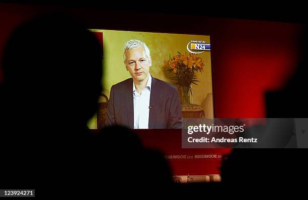 Wikileaks founder Julian Assange speaks to participants at the IFA 2011 Media Week via a live satellite broadcast on September 6, 2011 in Berlin,...