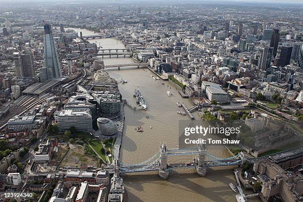 An aerial view of the Thames river in London from the air with the Shard and Tower Bridge in the foreground on September 5, 2011 in London, England.