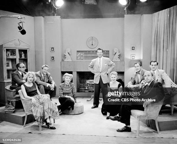 Emcee Mike Stokey stands between opposing teams slated for the battle of 'identifications' on the CBS television game show "Pantomime Quiz." Guests...