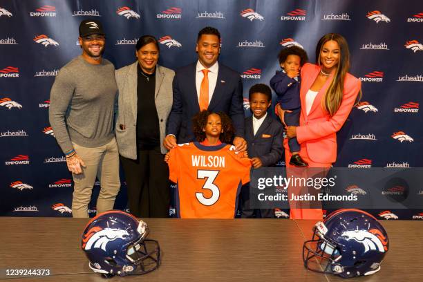 Quarterback Russell Wilson of the Denver Broncos poses with his family Harry, Tammy, Sienna, Future, Win and Ciara following an introductory press...