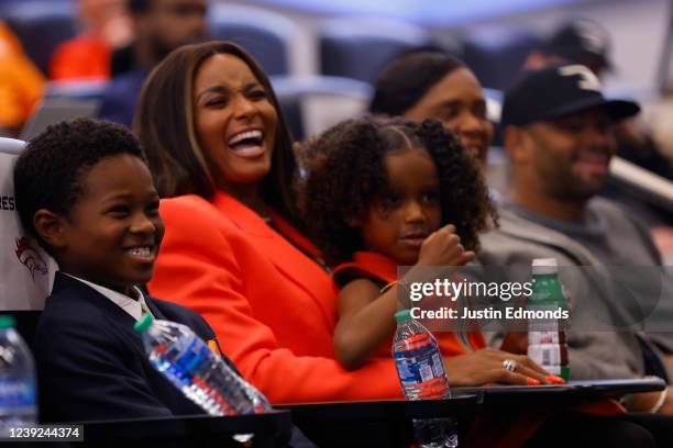 Family members of Quarterback Russell Wilson of the Denver Broncos Future, Ciara, Sienna, Tammy and Harry laugh during an introductory press...