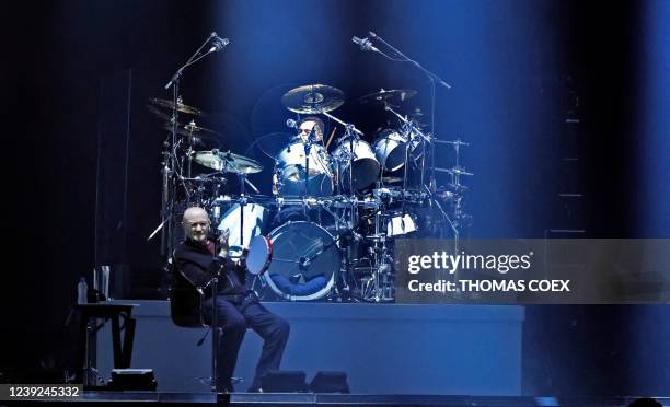 British singer Phil Collins performs on stage with his son and drummer Nicholas Collins aka Nic Collins during "The last domino" tour of the British...