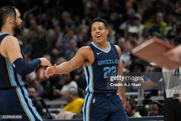 Desmond Bane high fives Dillon Brooks of the Memphis Grizzlies during the game against the Indiana Pacers on March 15, 2022 at Gainbridge Fieldhouse...