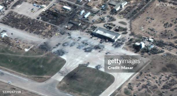 Maxar satellite imagery of destroyed Russian helicopters on tarmac and Russian ground forces deployment at Kherson airfield in Kherson, Ukraine....