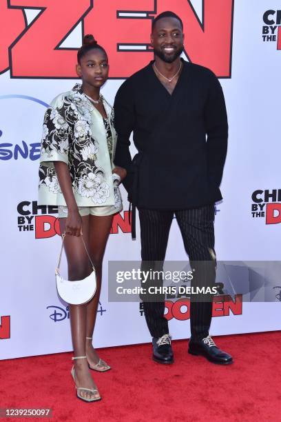 Former professional basketball player Dwyane Wade and his daughter Zaya Wade arrive for the "Cheaper by the Dozen" Disney premiere at the El Capitan...