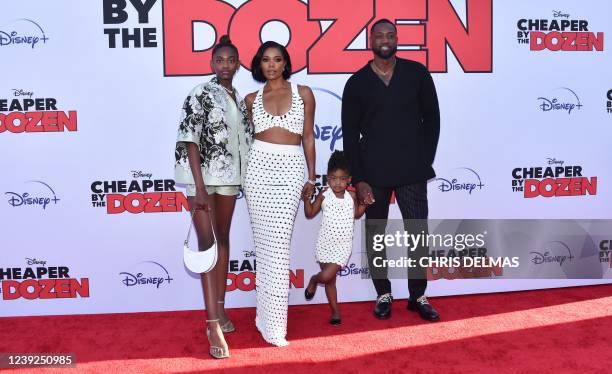 Actress Gabrielle Union and her husband former professional basketball player Dwyane Wade pose with daughters Zaya Wade and Kaavia James Union Wade...