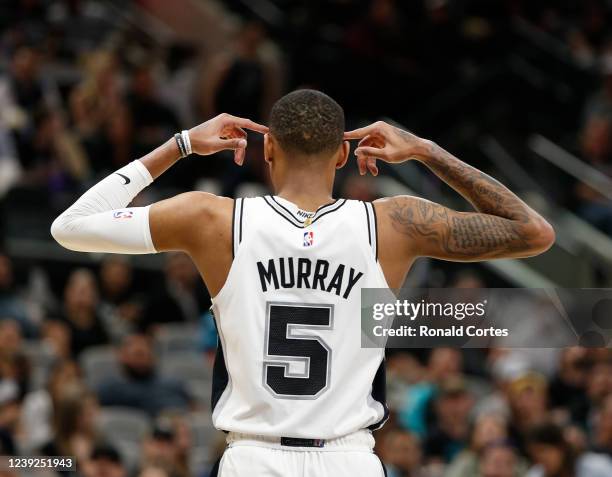 Dejounte Murray of the San Antonio Spurs reacts after one of his teammates committed a foul on a Oklahoma City Thunder player in the second half at...