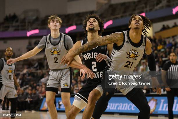 Northern Kentucky forward Chris Brandon , Northern Kentucky guard Sam Vinson , and Wright State guard Tanner Holden vie for position under the basket...