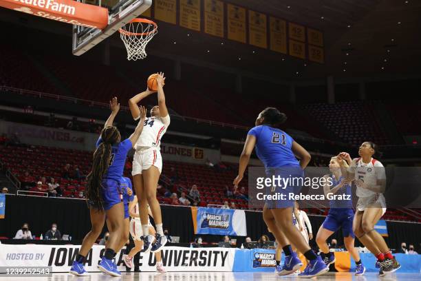 Tenin Magassa of the Dayton Flyers shoots over Aneesah Morrow of the DePaul Blue Demons during the First Four round of the 2022 NCAA Women's...
