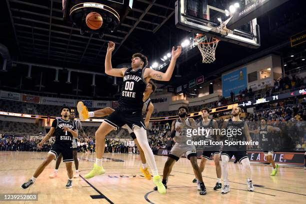 Wright State forward Grant Basile and Northern Kentucky guard Trey Robinson vie for a rebound during the Horizon League Tournament Championship game...