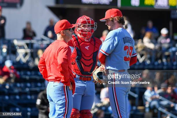 Ole Miss catcher Hayden Dunhurst , Ole Miss pitcher Jack Dougherty and Ole Miss Head Coach Mike Bianco meet on the mound during the college baseball...