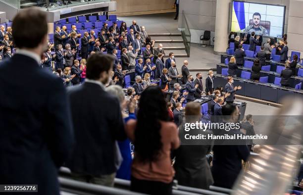 Ukrainian President Volodymyr Zelensky receives standing ovations before he addresses the German Bundestag via live video from the embattled city of...