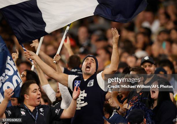 Blues fans celebrate during the 2022 AFL Round 01 match between the Carlton Blues and the Richmond Tigers at the Melbourne Cricket Ground on March...