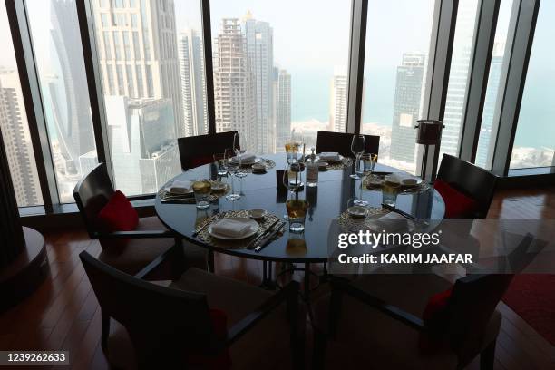 Dining table is pictured at the JW Marriott Marquis hotel in the Qatari capital Doha on March 16, 2022. - Fans have sought 17 million tickets for...