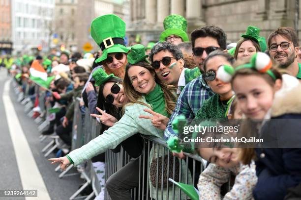 Revellers line the streets during the St Patrick's Day parade on March 17, 2022 in Dublin, Ireland. St Patrick's Day celebrations return to the...